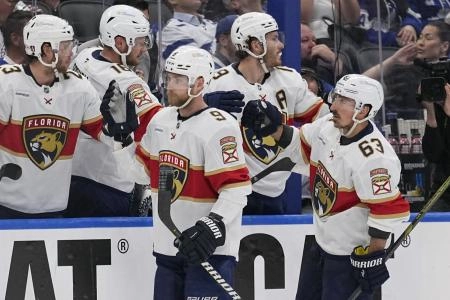 Florida Panthers forward Brad Marchand and Sam Bennett celebrating a goal being scored against the Toronto Maple Leafs. Florida Panthers forward Brad Marchand and Sam Bennett celebrating a goal being scored against the Toronto Maple Leafs.