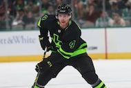 Dallas Stars defenseman Miro Heiskanen (4) skates the puck up the ice during an NHL game...
