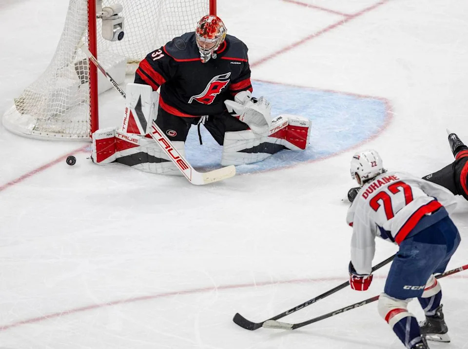 Carolina Hurricanes goalie Frederik Andersen (31) deflects a shot by Washington Capitals right wing Brand Duhaime (22) in the second period during Game 4 of their series on Monday, May 12, 2025 at Lenovo Center in Raleigh, N.C.