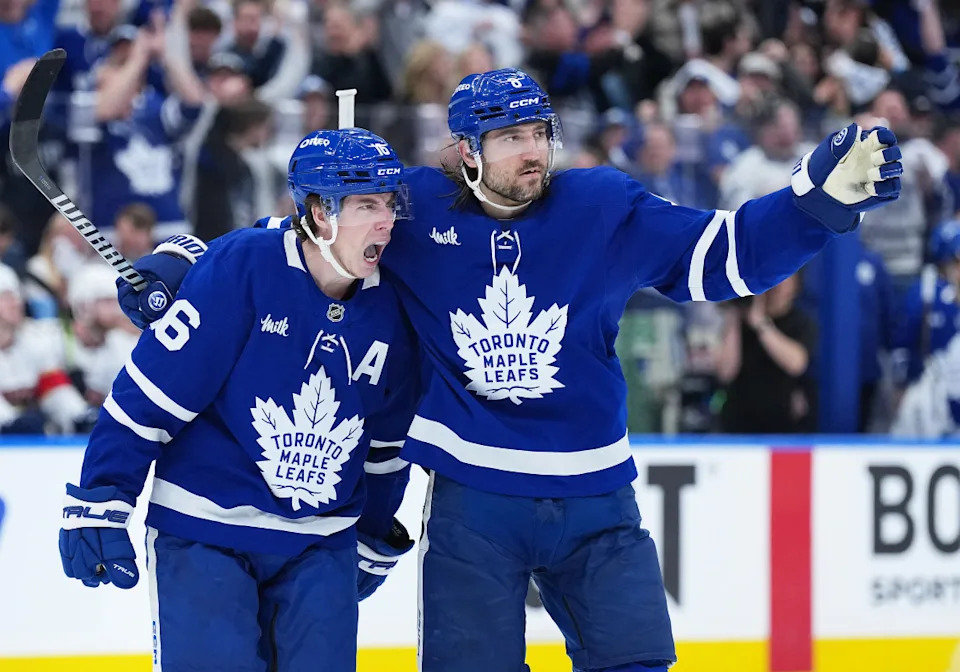 Toronto Maple Leafs right wing Mitch Marner (16) scores a goal and celebrates with defenseman Chris Tanev (8) against the Florida Panthers.Nick Turchiaro-Imagn Images