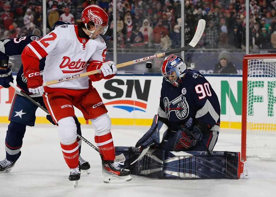 Columbus Blue Jackets goalie Elvis Merzlikins (90) makes a save as Detroit Red Wings center Marco Kasper (92) looks for a rebound during the first period at Ohio Stadium in Columbus, Ohio, on Saturday, March 1, 2025.