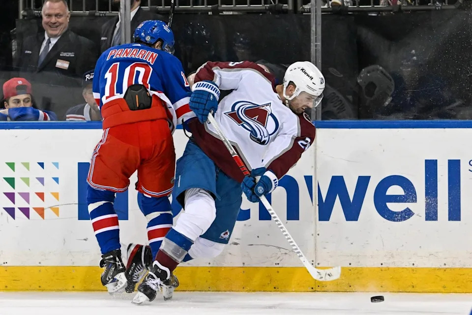 New York Rangers left wing Artemi Panarin (10) checks Colorado Avalanche center Nathan MacKinnon (29) during the third period at Madison Square Garden.Dennis Schneidler-Imagn Images