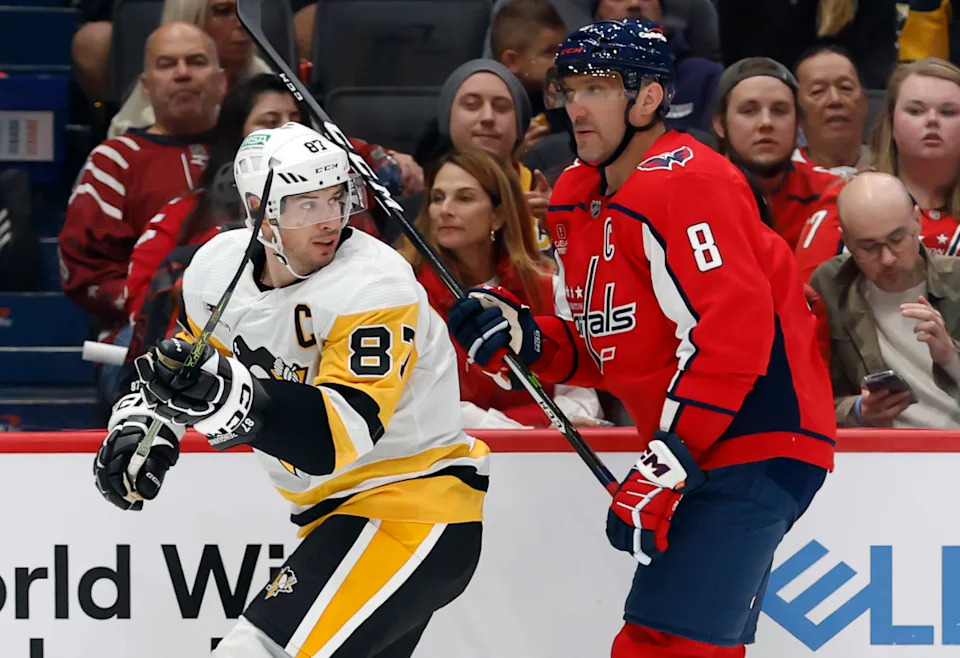 Pittsburgh Penguins center Sidney Crosby (87) and Washington Capitals left wing Alex Ovechkin (8) skate in the second period at Capital One Arena.Geoff Burke-Imagn Images