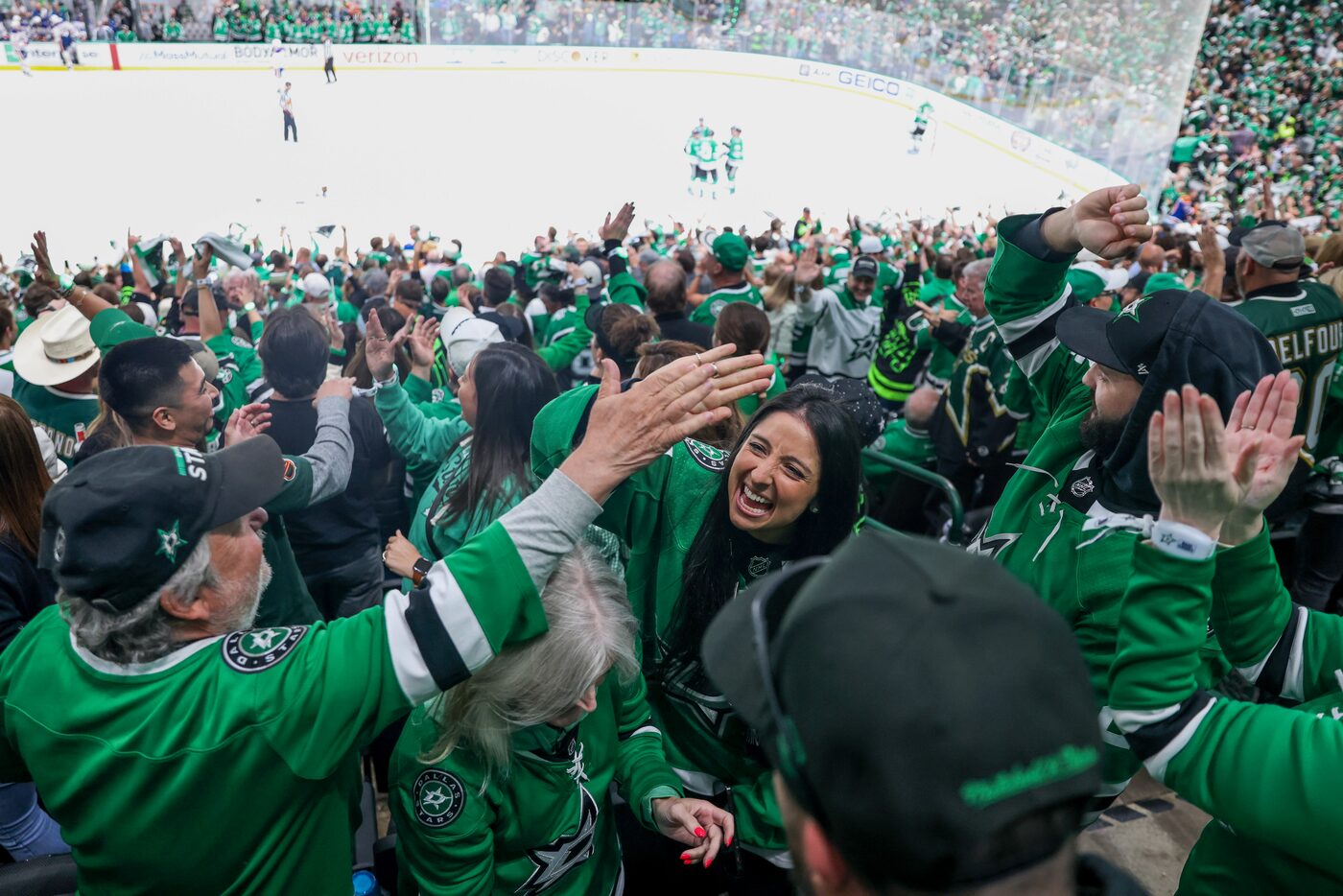 Dallas Stars fans celebrates after a Stars goal during the third period in Game 1 of the NHL...