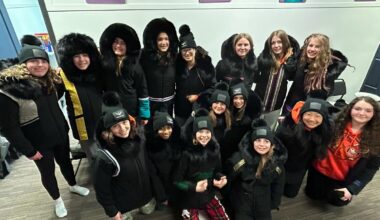 Handmade parkas were gifted to visiting hockey players from Oakville, Ontario, in Rankin Inlet, Nunavut. The team is part of an exchange which welcomed female players from Rankin Inlet to Ontario earlier this year.  (Kelly Clark Lindell - image credit)