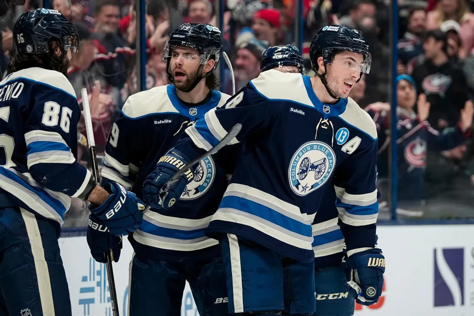 Columbus Blue Jackets defenseman Zach Werenski (8) celebrates scoring a goal with right wing Kirill Marchenko (86) and center Adam Fantilli (19) during the third period of the NHL hockey game against the Philadelphia Flyers at Nationwide Arena in Columbus on Jan. 14, 2025. The Blue Jackets won 3-2 in a shootout.