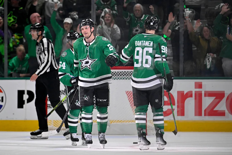 Dallas Stars center Roope Hintz (24) and right wing Mikko Rantanen (96) celebrates an empty net goal scored by Hintz.Jerome Miron-Imagn Images