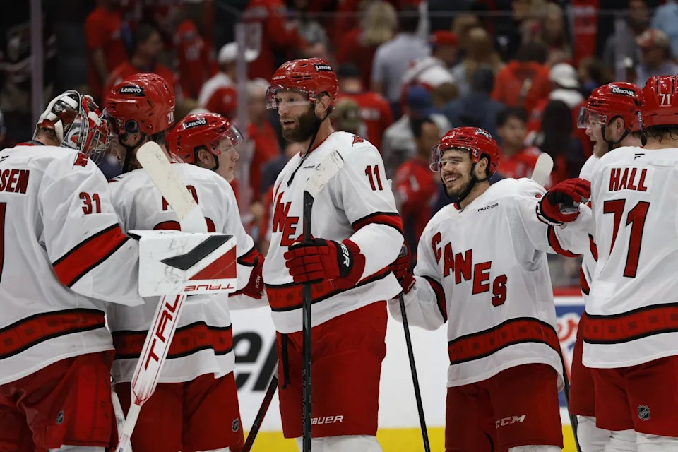 Carolina Hurricanes players celebrate after their series clinching win against the Washington Capitals in game five of the second round of the 2025 Stanley Cup Playoffs at Capital One Arena.Geoff Burke-Imagn Images