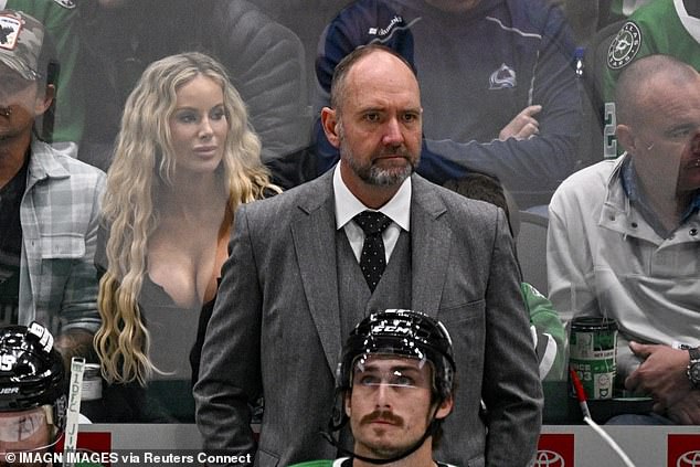 The stunning blonde was sitting over the shoulder of Dallas Stars head coach Peter DeBoer