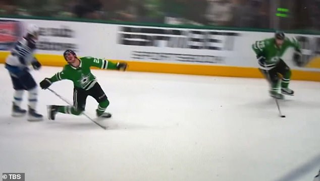 Mason Marchment falls to the ice after an incident involving a Winnipeg Jets player