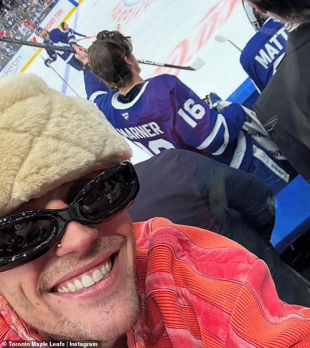 In photos posted to the National Hockey League's Instagram account, Justin could be seen sitting in the front row as he wrapped an arm around Hailey while showing off an extreme smile. He also posed for a closeup selfie