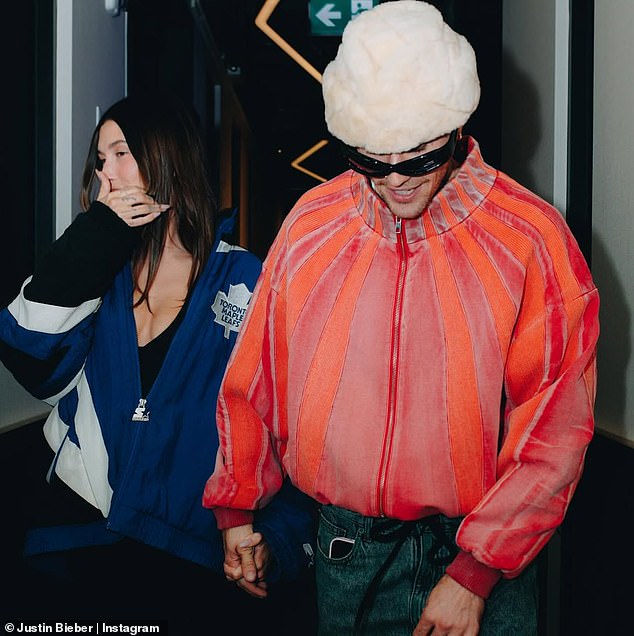 Hailey appeared to wear a black low-cut tank top that highlighted her cleavage under her jacket, and she paired it with black pants