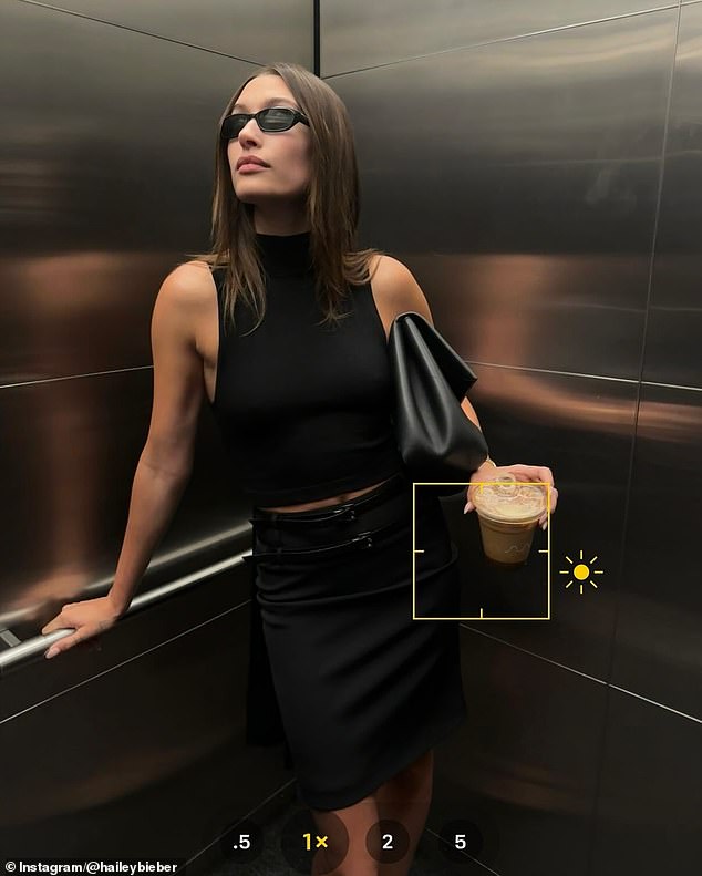 She looked more elegant in an elevator photo showing her in a black cropped tank top with a matching mini skirt, a large black leather bag tucked under her arm and slim black sunglasses