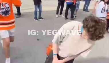 An Edmonton Oilers fan got slapped and knocked unconscious by a fellow fan on Thursday