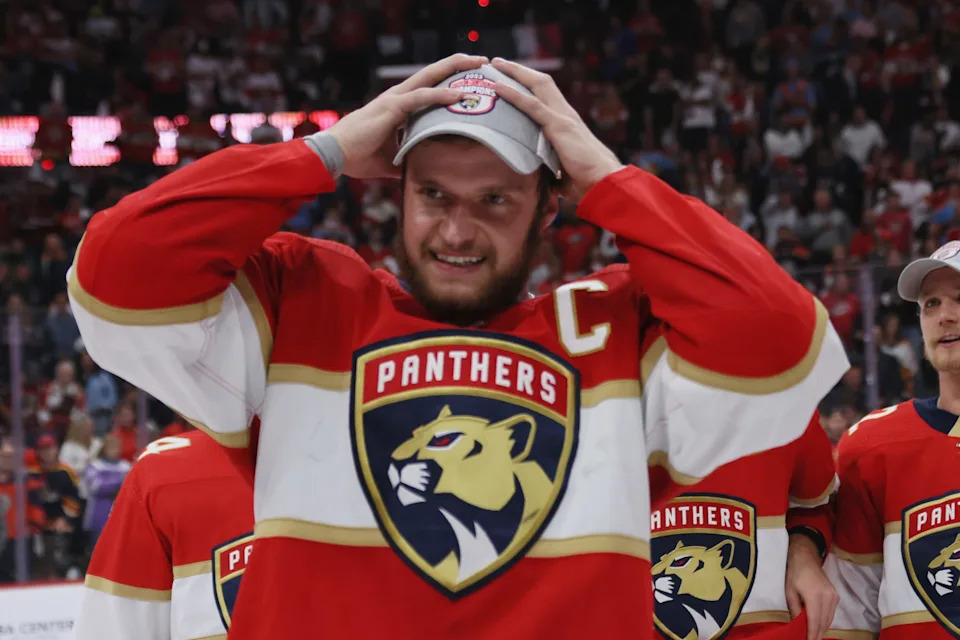 SUNRISE, FLORIDA - MAY 24: Aleksander Barkov #16 of the Florida Panthers puts on the conference championship hat after the game against the Carolina Hurricanes in Game Four of the Eastern Conference Finals of the 2023 Stanley Cup Playoffs at FLA Live Arena on May 24, 2023 in Sunrise, Florida. The Panthers defeated the Hurricanes 4-3 to take the series 4-0. (Photo by Bruce Bennett/Getty Images)