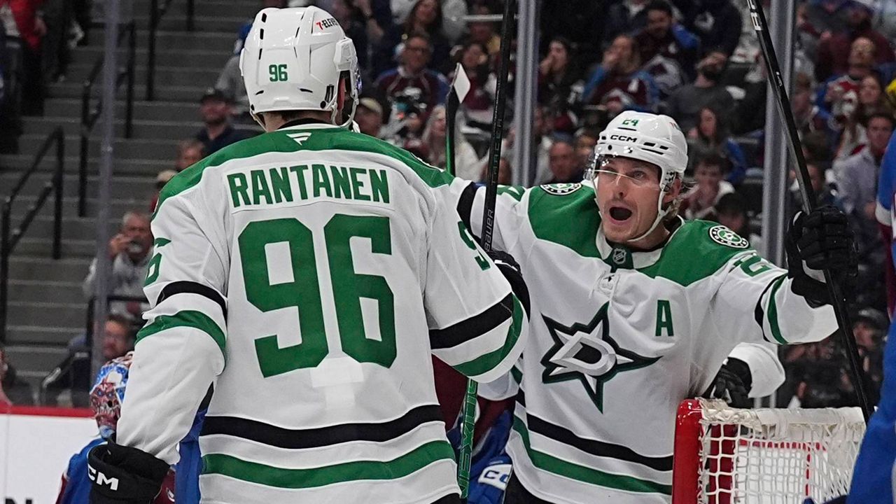 Dallas Stars right wing Mikko Rantanen (96) congratulates center Roope Hintz, after, after his goal in the second period of Game 6 of an NHL hockey first-round playoff series against the Colorado Avalanche, Thursday, May 1, 2025, in Denver. (AP Photo/David Zalubowski)