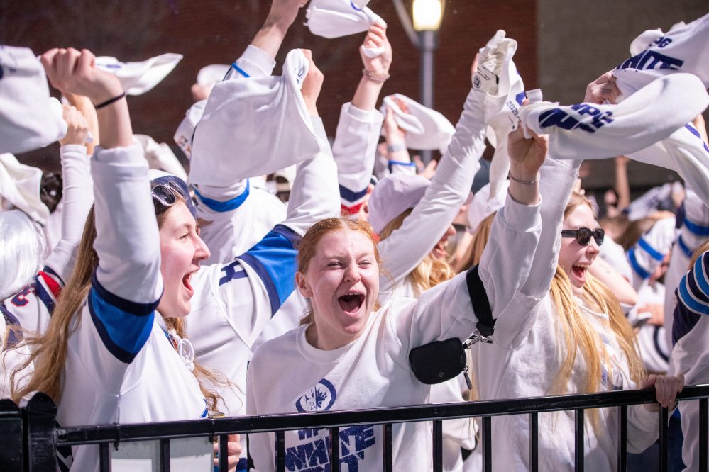 BROOK JONES/FREE PRESS
Winnipeg Jets fans Leah Clausser (middle), Gabbry Robbins (left) and Kennedy Peters cheer after the Jets score their team's first goal of the Game 5 in the National Hockey League Stanley Cup playoff between the hometown Winnipeg Jets and the visiting St. Louis Blues in Winnipeg, Man., Saturday, April 19, 2025. The Winnipeg Jets Whiteout party tooks place on Donald Street between Portage Avenue and Graham Avenue.