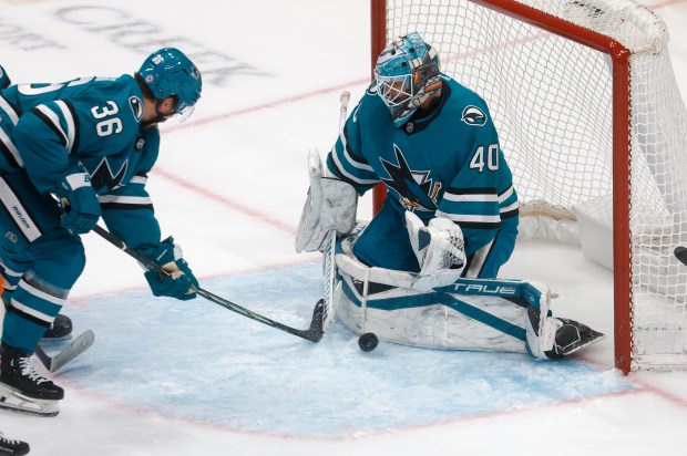 San Jose Sharks goaltender Alexander Georgiev (40) blocks a shot...