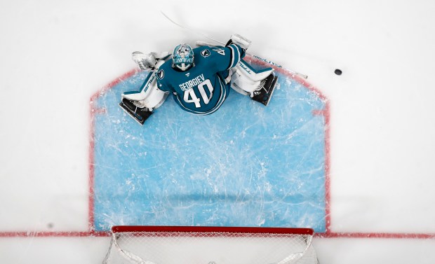 San Jose Sharks goaltender Alexander Georgiev (40) blocks a shot...