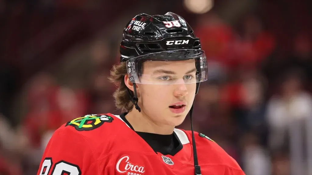 Connor Bedard #98 of the Chicago Blackhawks looks on prior to the game against the Seattle Kraken at the United Center on March 18, 2025 in Chicago, Illinois.