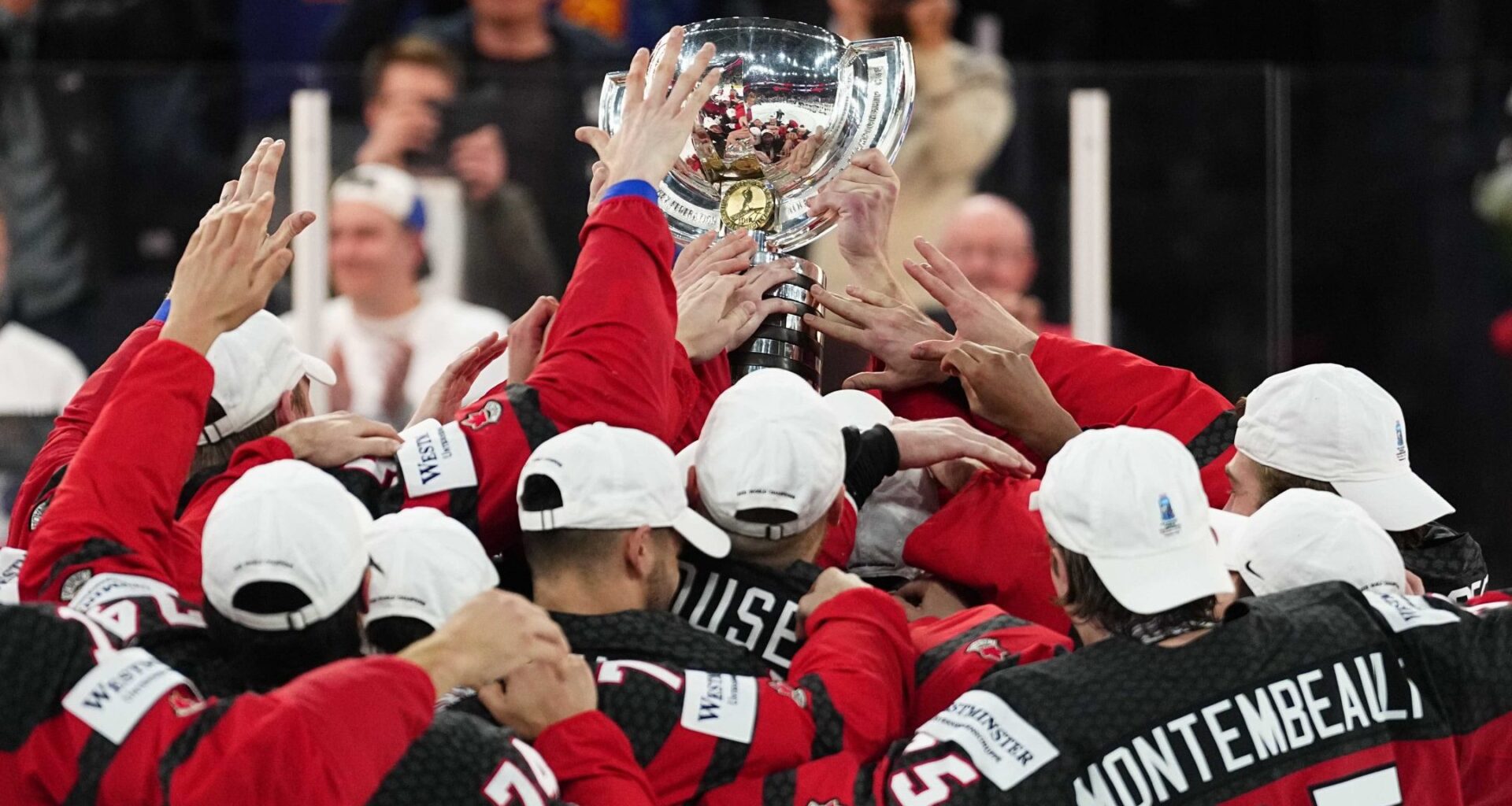 Canada hoists its trophy after defeating Germany to win the Ice Hockey World Championship.