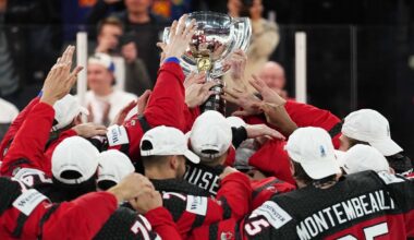 Canada hoists its trophy after defeating Germany to win the Ice Hockey World Championship.