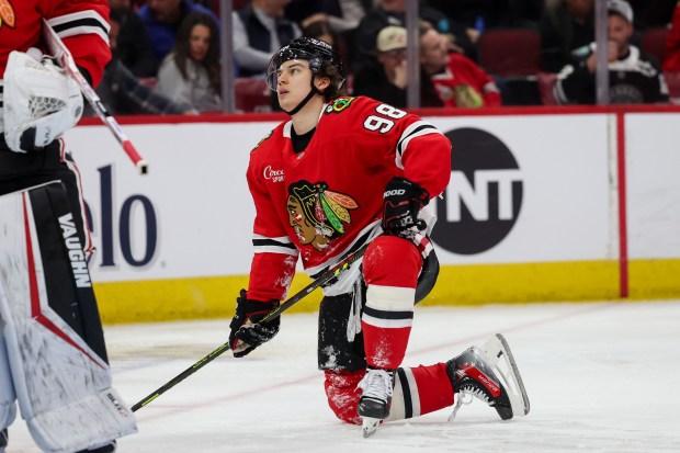 Blackhawks center Connor Bedard gets up off the ice after falling and being called for hooking against the Oilers on Feb. 5, 2025, at the United Center. (Armando L. Sanchez/Chicago Tribune)