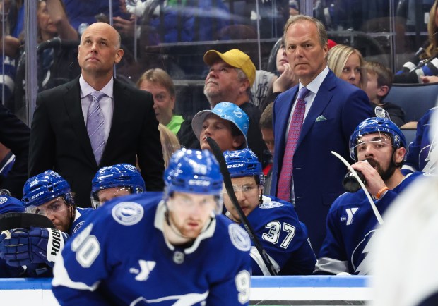 Former Lightning assistant coach Jeff Blashill, left, and head coach Jon Cooper look on from the bench during Game 5 of a first-round playoff series loss to the Panthers. Blashill was hired May 22 as the Blackhawks head coach. (Dirk Shadd/Tampa Bay Times/TNS)