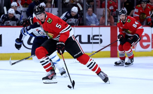 Blackhawks defenseman Connor Murphy takes off down the ice with the puck in the first period against the Jets on April 12, 2025, at the United Center. (Chris Sweda/Chicago Tribune)