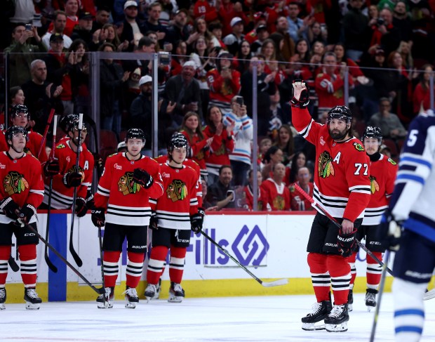 Blackhawks left wing Patrick Maroon (77) waves to the crowd during a break in the first period against the Jets on April 12, 2025, at the United Center. It was the last NHL game for Maroon, who is retiring. (Chris Sweda/Chicago Tribune)