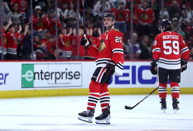 Blackhawks defenseman Alec Martinez (25) acknowledges applause from the crowd during a break in the third period against the Jets on April 12, 2025, at the United Center. It was the retiring Martinez's final NHL game. (Chris Sweda/Chicago Tribune)