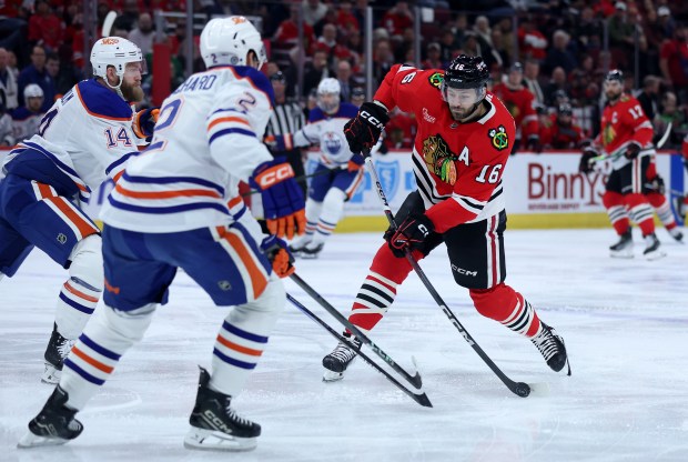 Chicago Blackhawks center Jason Dickinson (16) takes a shot on goal in the first period of a game against the Edmonton Oilers at the United Center in Chicago on Jan. 11, 2025. (Chris Sweda/Chicago Tribune)