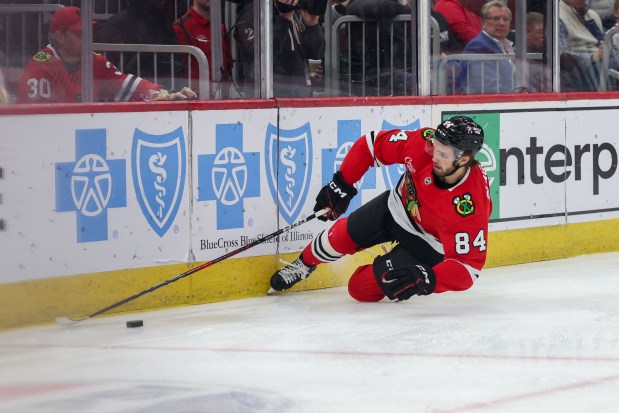 Chicago Blackhawks left wing Landon Slaggert (84) falls on the ice while chasing the puck during the first period against the Seattle Kraken at the United Center Tuesday March 18, 2025, in Chicago. (Armando L. Sanchez/Chicago Tribune)