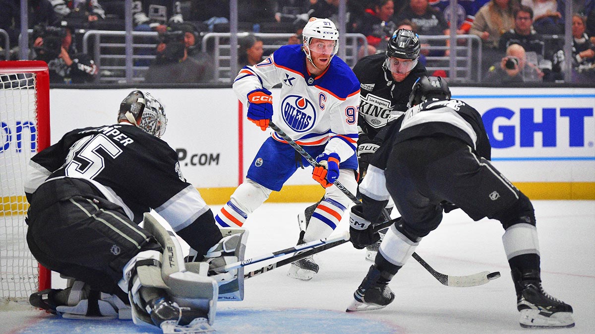 Edmonton Oilers center Connor McDavid (97) moves in for a shot on goal against Los Angeles Kings goaltender Darcy Kuemper (35) center Anze Kopitar (11) and defenseman Mikey Anderson (44) during the first period at Crypto.com Arena.