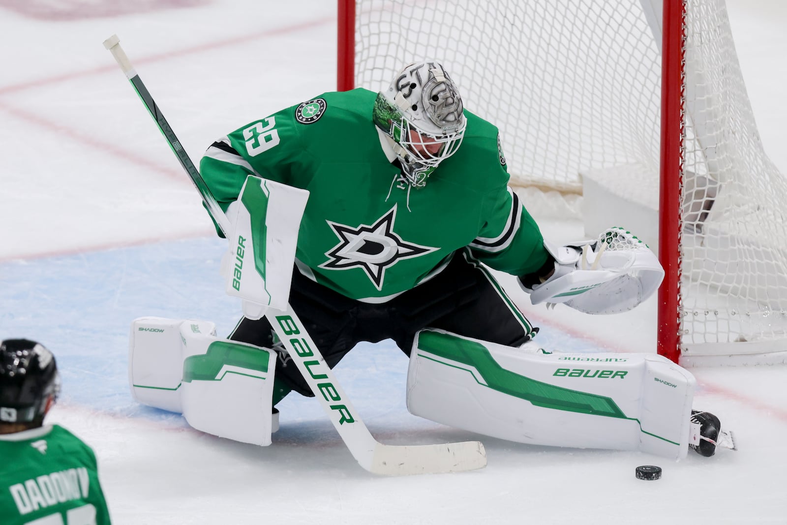 Dallas Stars goaltender Jake Oettinger blocks a shot in the third period of Game 4 of a second-round NHL hockey playoff series in Dallas, Tuesday, May 13, 2025. (AP Photo/Gareth Patterson)