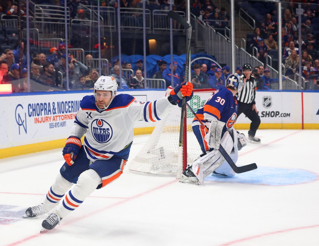 Edmonton Oilers center Leon Draisaitl (29) scored the game-winning goal as New York Islanders goaltender Ilya Sorokin (30) tries to stop In overtime 