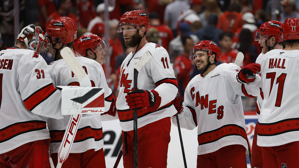 Carolina Hurricanes players celebrate after their series clinching win against the Washington Capitals in game five of the second round of the 2025 Stanley Cup Playoffs at Capital One Arena.