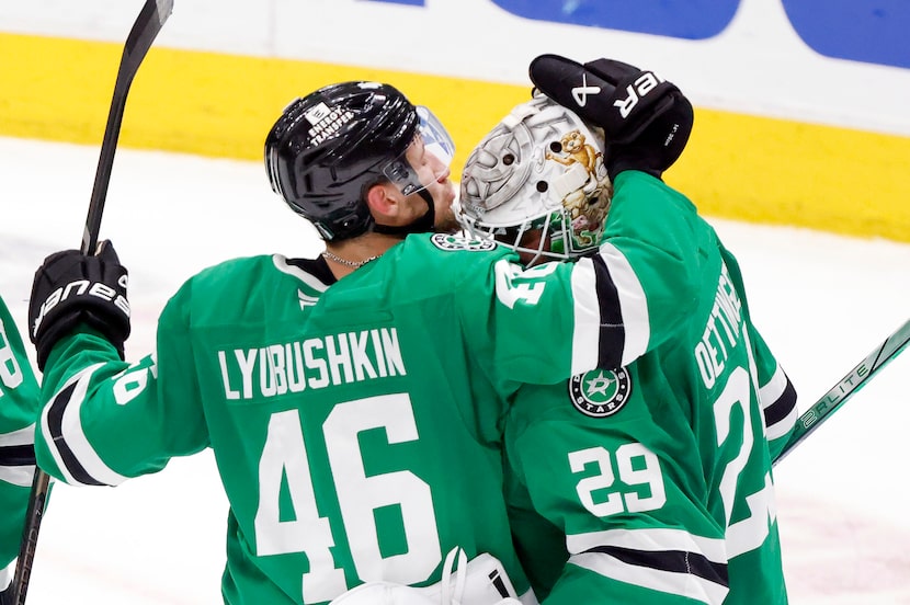 Dallas Stars defenseman Ilya Lyubushkin (46) gives his goaltender Jake Oettinger (29) a big...