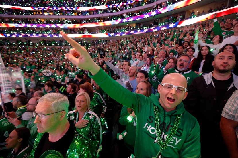 Dallas Stars fan Justin Francis of Austin, Texas yells ‘Stars!’ during the playing of the...