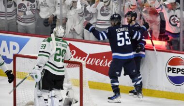 Winnipeg Jets' Mark Scheifele (55) celebrates his goal against Dallas Stars goaltender Jake Oettinger (29) with Kyle Connor (81) during second period NHL playoff hockey action in Winnipeg, Thursday, May 15, 2025. (Fred Greenslade/The Canadian Press via AP)