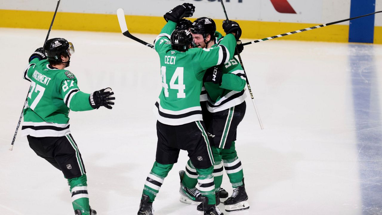 Dallas Stars' Mason Marchment (27), Cody Ceci (44) and Thomas Harley, right, celebrate Harley's goal in overtime of Game 6 of a second-round NHL hockey playoff series against the Winnipeg Jets in Dallas, Saturday, May 17, 2025. (AP Photo/Gareth Patterson)