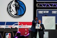 Dallas Mavericks' Rolando Blackman, left, and NBA Deputy Commissioner Mark Tatum, right,...