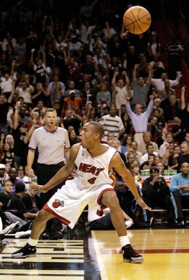 MIAMI - MAY 4:  Caron Butler #4 of the Miami Heat reacts after dunking over Baron Davis of the New Orleans Hornets in the first quarter of Game seven of the Eastern Conference Quarterfinals during the 2004 NBA Playoffs May 4, 2004 at the American Airlines Arena in Miami, Florida.  (Photo by Eliot J. Schechter/Getty Images)  *** Local Caption *** Caron Butler ORG XMIT: 50796225