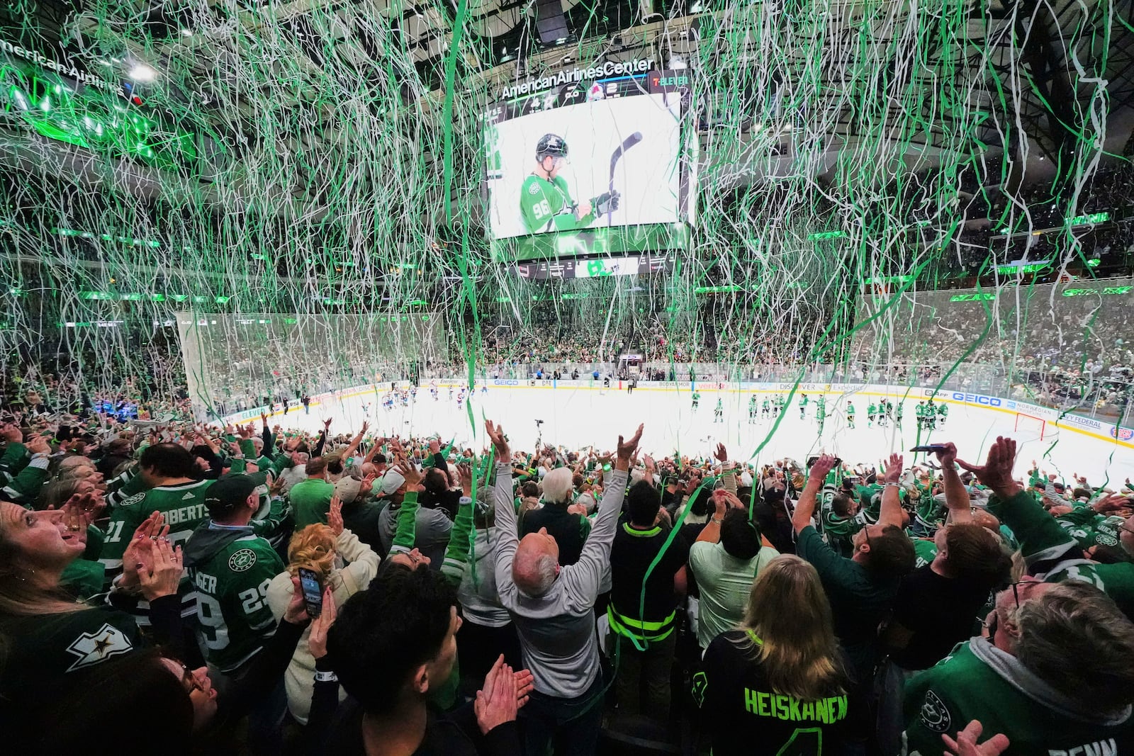 Dallas Stars' Mikko Rantanen is shown on the large video board as fans celebrate the Stars 4-2 win against the Colorado Avalanche in Game 7 of a first-round NHL hockey playoff series Saturday, May 3, 2025, in Dallas. (AP Photo/Julio Cortez)