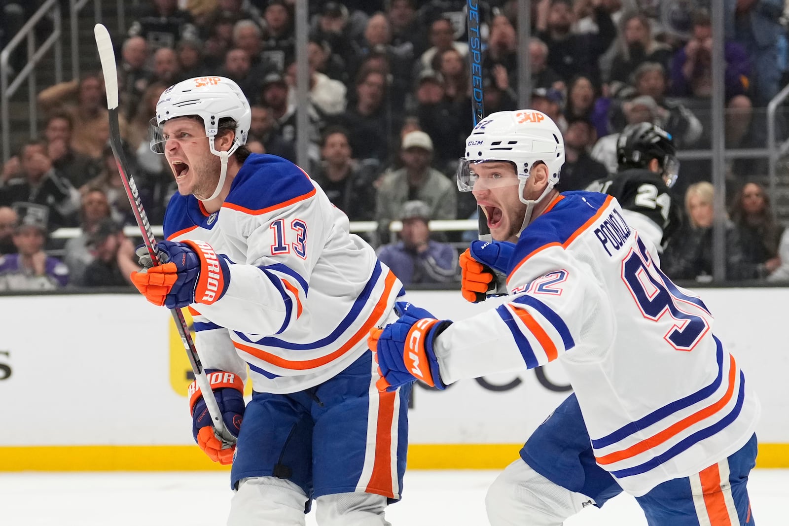 Edmonton Oilers center Mattias Janmark, left, celebrates his goal with right wing Vasily Podkolzin during the third period in Game 5 of an NHL hockey first-round playoff series against the Los Angeles Kings, Tuesday, April 29, 2025, in Los Angeles. (AP Photo/Mark J. Terrill)