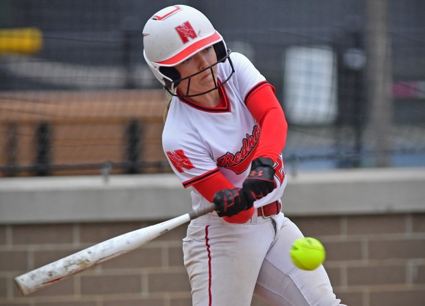 Naperville Central's Avery Hayward hits the ball 