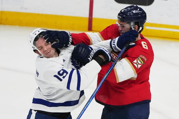 Toronto Maple Leafs center Calle Jarnkrok (19) and Florida Panthers defenseman Jaycob Megna (6) during the third period of an NHL hockey game, Tuesday, April 8, 2025, in Sunrise, Fla. (AP Photo/Lynne Sladky)