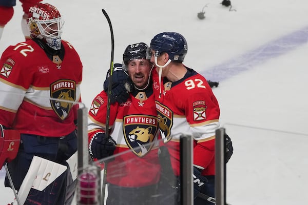 Florida Panthers center Brad Marchand (63) celebrates after scoring the game winning goal during overtime in Game 3 of a second-round NHL hockey playoff series Toronto Maple Leafs, Friday, May 9, 2025, in Sunrise, Fla. (AP Photo/Marta Lavandier)