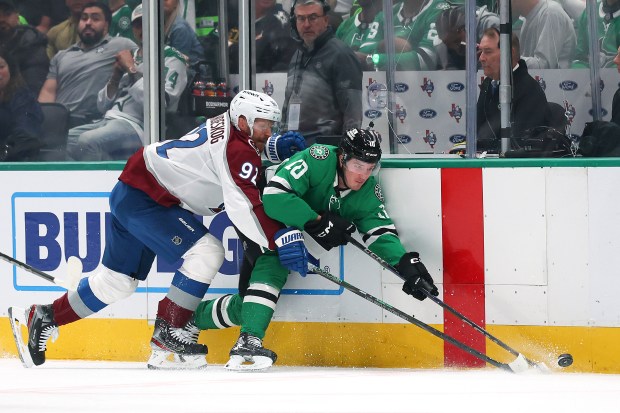 Oskar Back (10) of the Dallas Stars is checked by Gabe Landeskog (92) of the Colorado Avalanche during the first period in Game 7 of their first-round playoff series at American Airlines Center on May 03, 2025 in Dallas, Texas. (Photo by Richard Rodriguez/Getty Images)