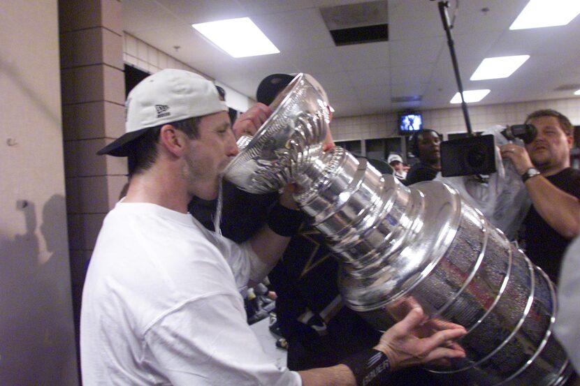 ORG XMIT: S11A11371 6/19/99 - Stanley Cup Finals, Game 6 - The Stars' Guy Carbonneau takes a...